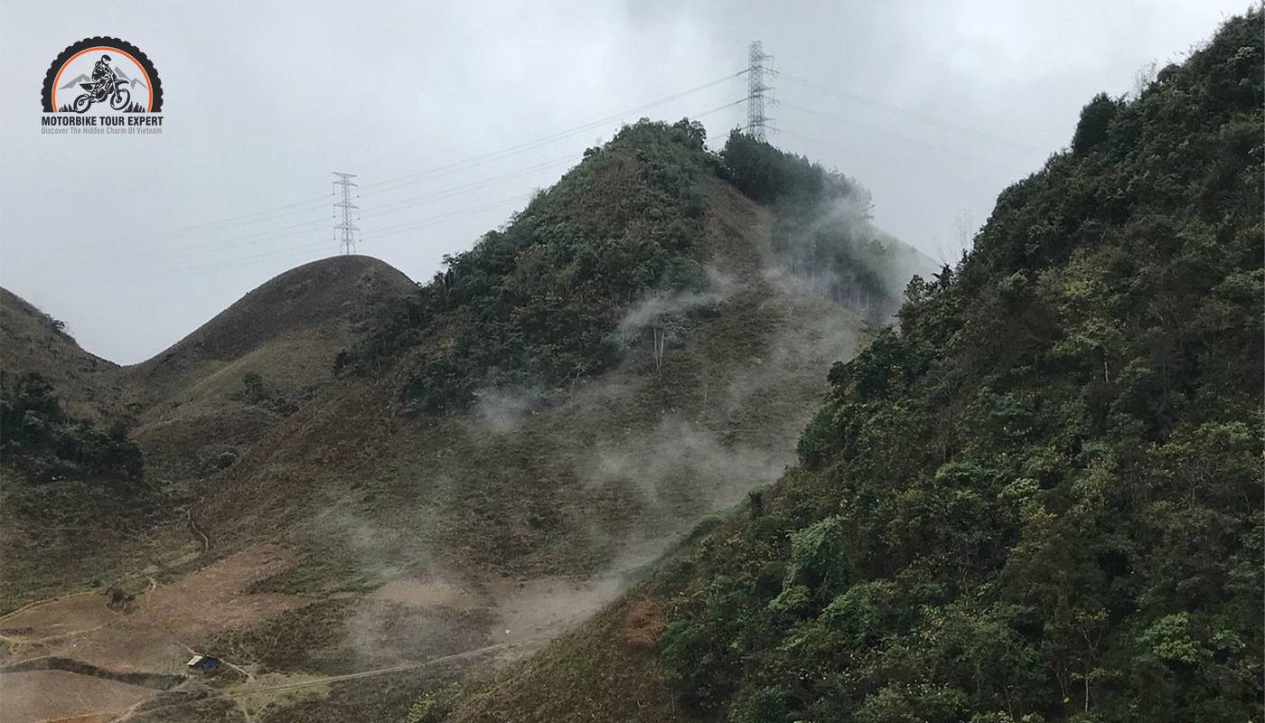 Riding through the fog in the morning when joining Moc Chau Motorbike tours