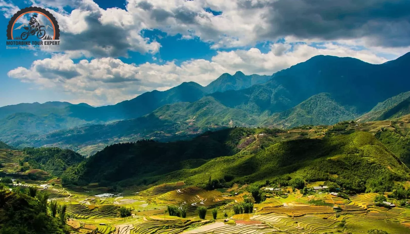 Lush green terraced rice fields stretching across the hillsides, creating a spectacular view