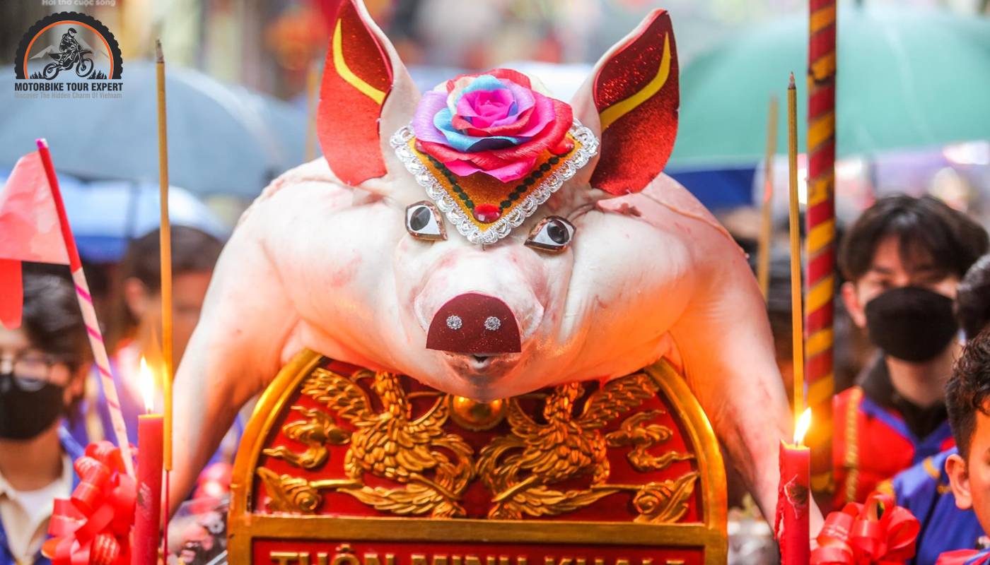 People celebrate the procession of “Mr. Pig” in La Phu village