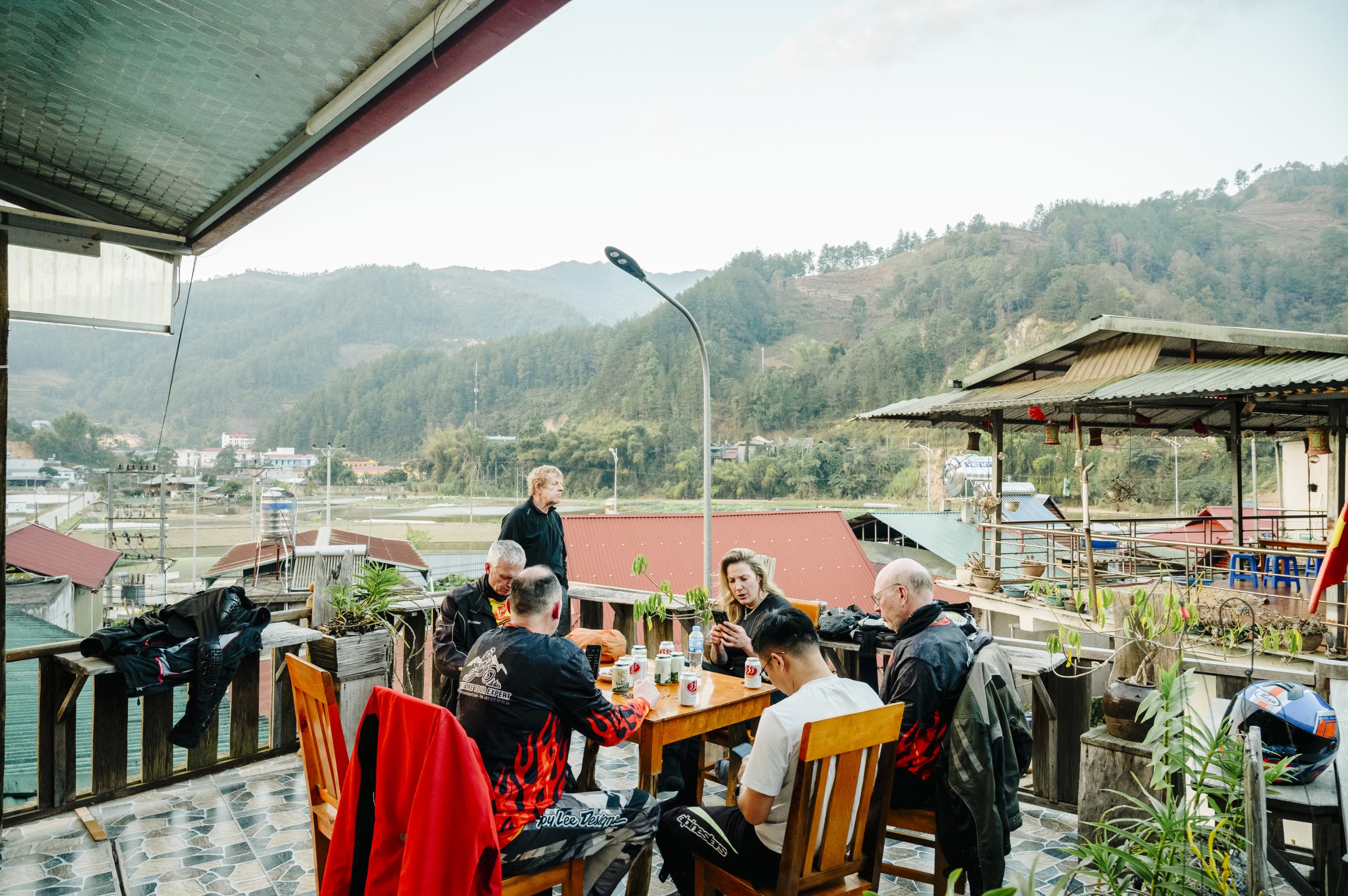 Travelers enjoying a meal at a mountain restaurant in Northern Vietnam.
