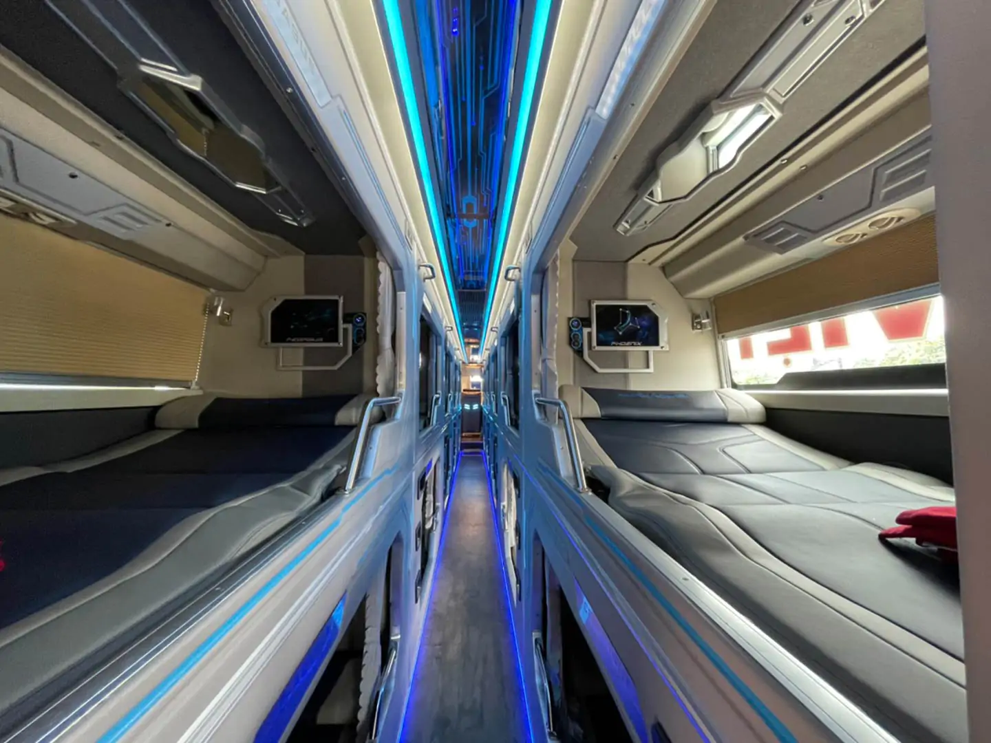 Sleeper cabin with berths and modern interior for long-distance travel in Vietnam.