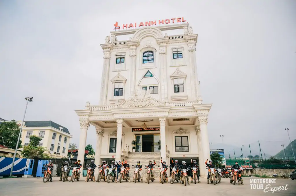 Private group self-rider motorcycle tour riders parked in front of Hai Anh Hotel in Vietnam